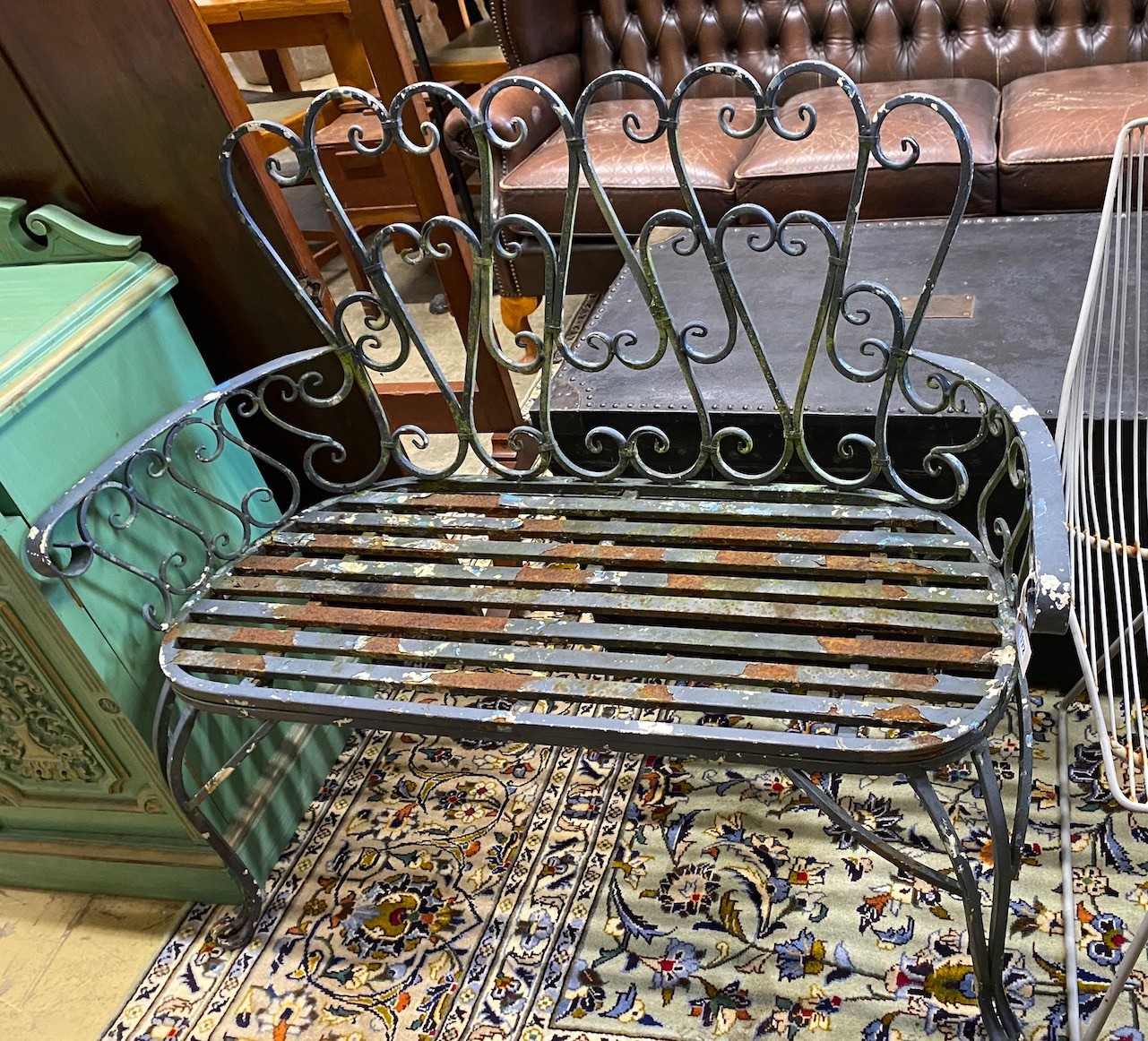A painted metal garden bench, length 109cm, width 42cm, height 96cm